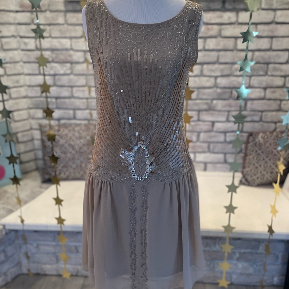 Champagne sequinned evening dress.